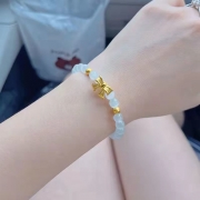 미르보석 클라우드 골드 리본장식  손목 위에 행운을 담다 묘안석 에너지 팔찌  s2100